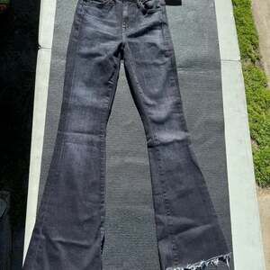 MOTHER The Weekender Fray High Rise Flare Jeans thunder road